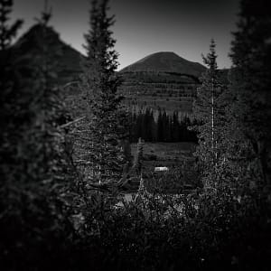 b&w photo of airstream camping in San Juan national forest, Colorado